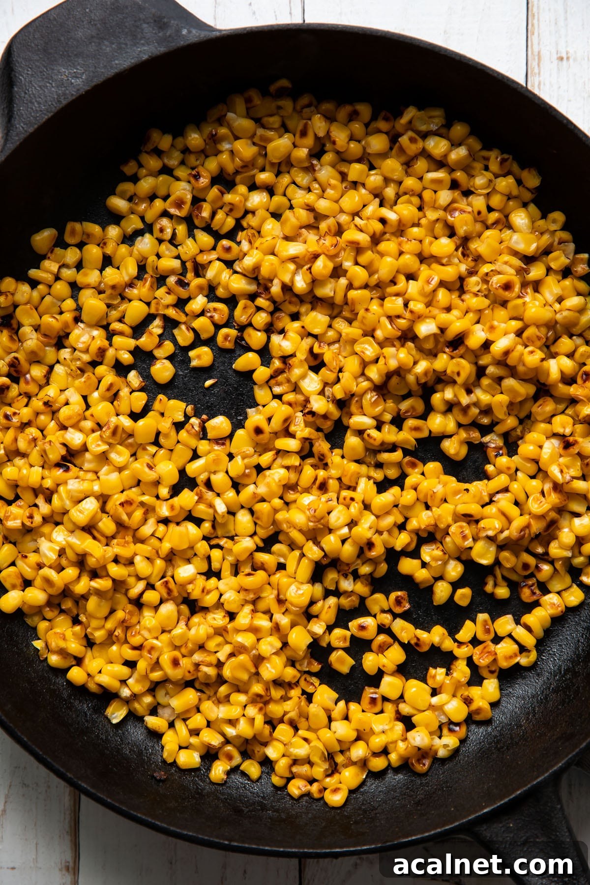 charred corn in a skillet