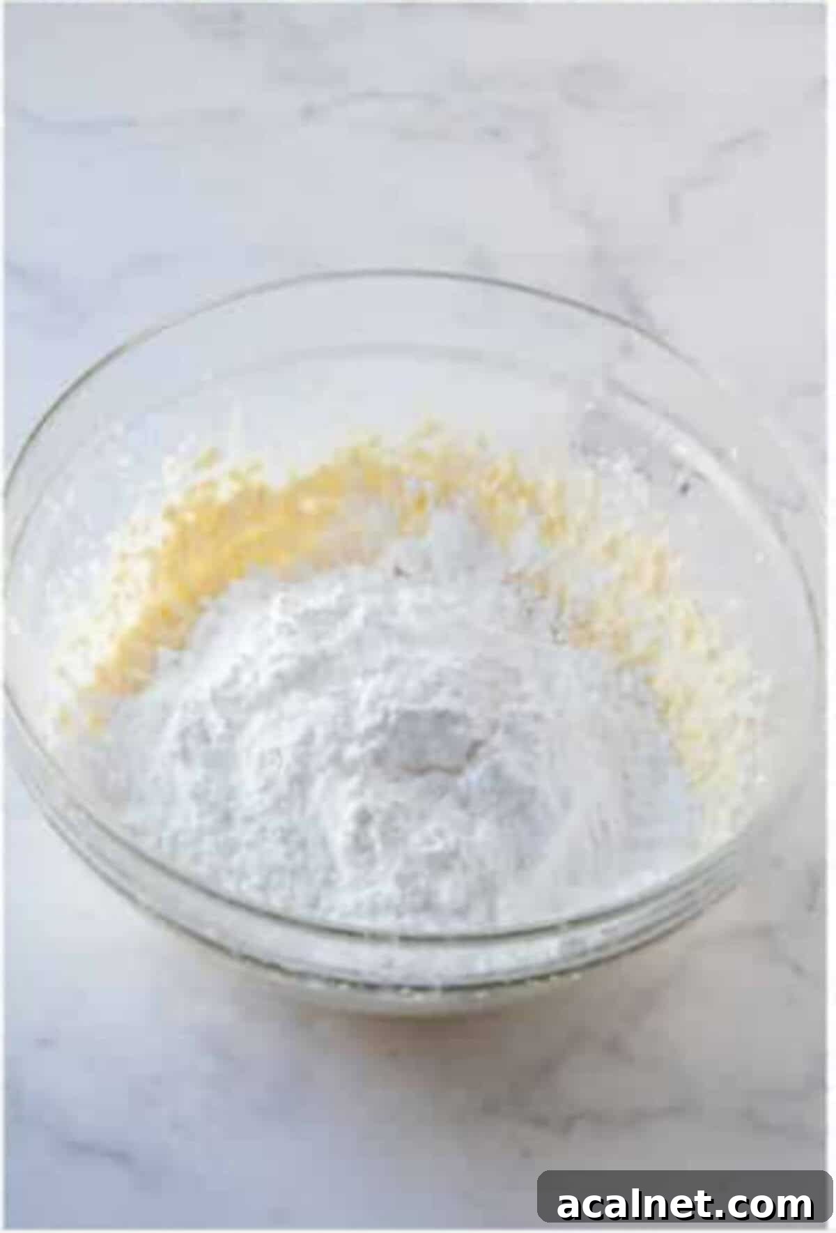 Cream cheese mixture beaten smooth in a bowl.