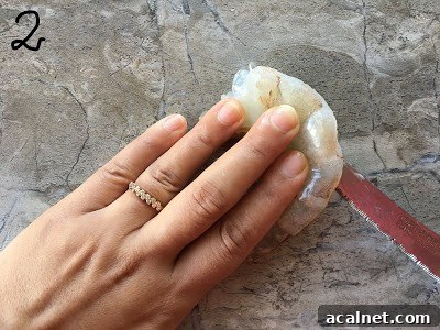 Slicing the shrimp on the side through.