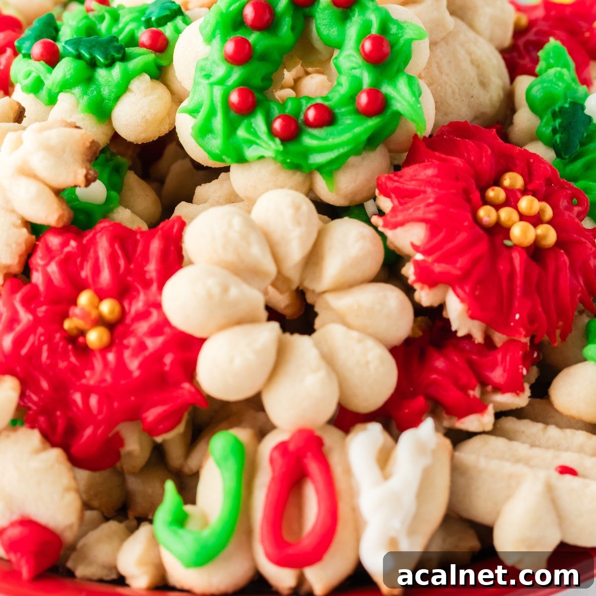 Classic Christmas Spritz Cookie Recipe 2 Christmas Spritz Cookies stacked on platter