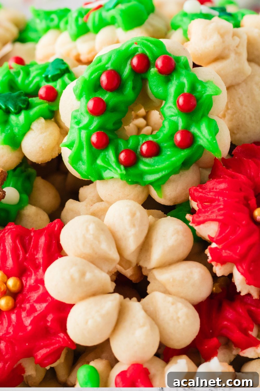 Classic Christmas Spritz Cookie Recipe 20 press cookies stacked on top of each other on table