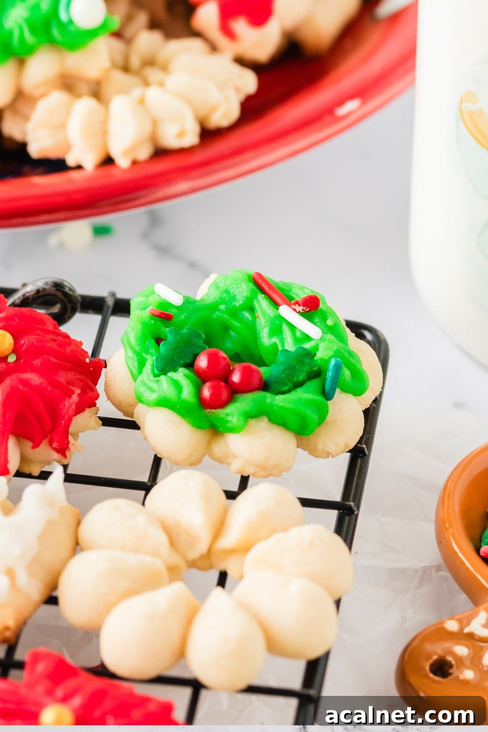 Classic Christmas Spritz Cookie Recipe 3 Christmas Spritz Cookies on a cookie tray on table