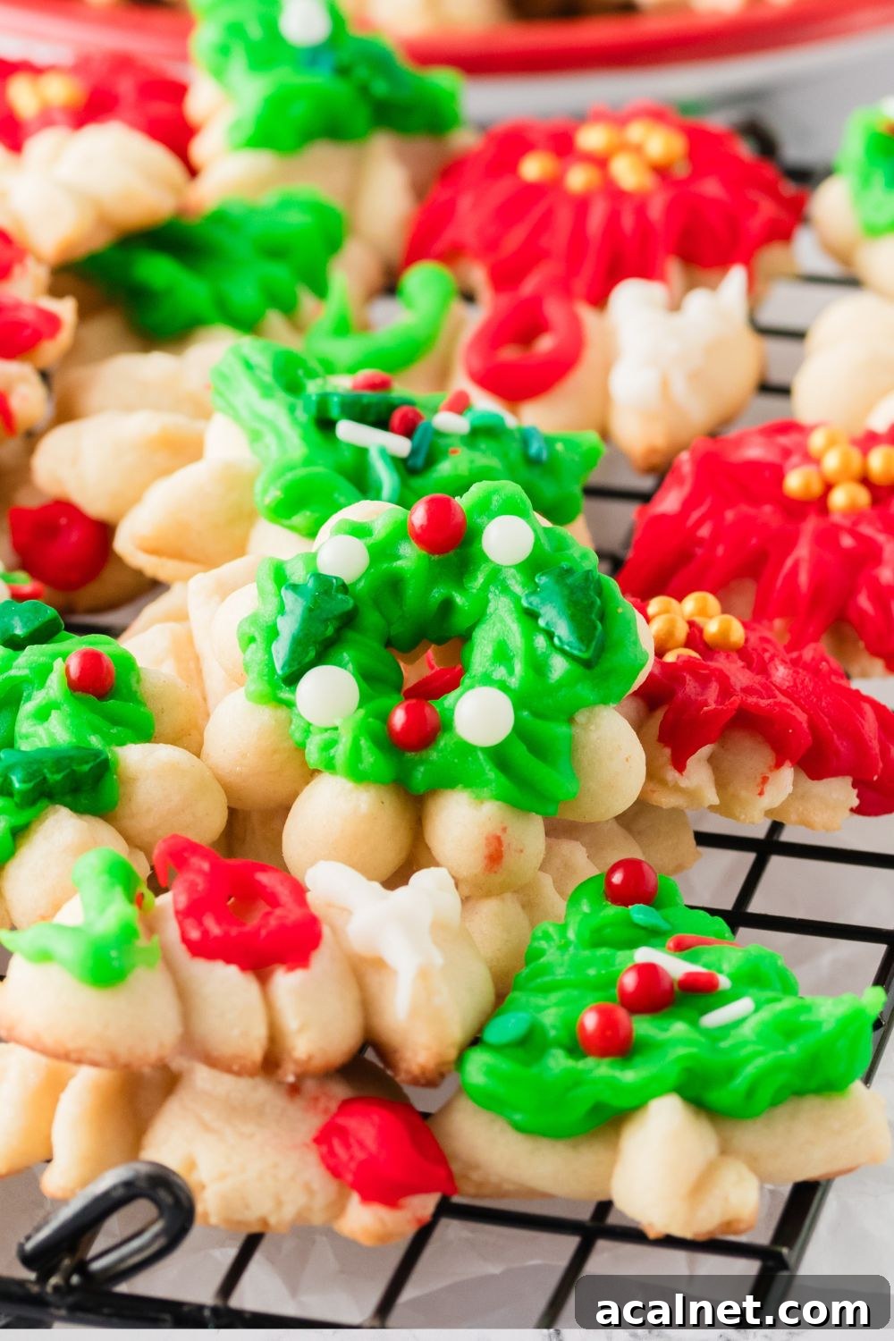 Classic Christmas Spritz Cookie Recipe 21 cookie press cookies on a metal cooling tray
