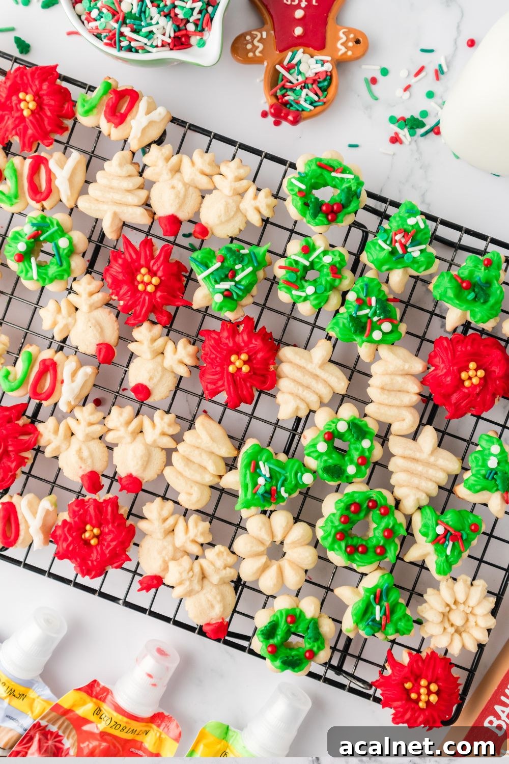 Classic Christmas Spritz Cookie Recipe 4 spritz cookies on baking rack on table