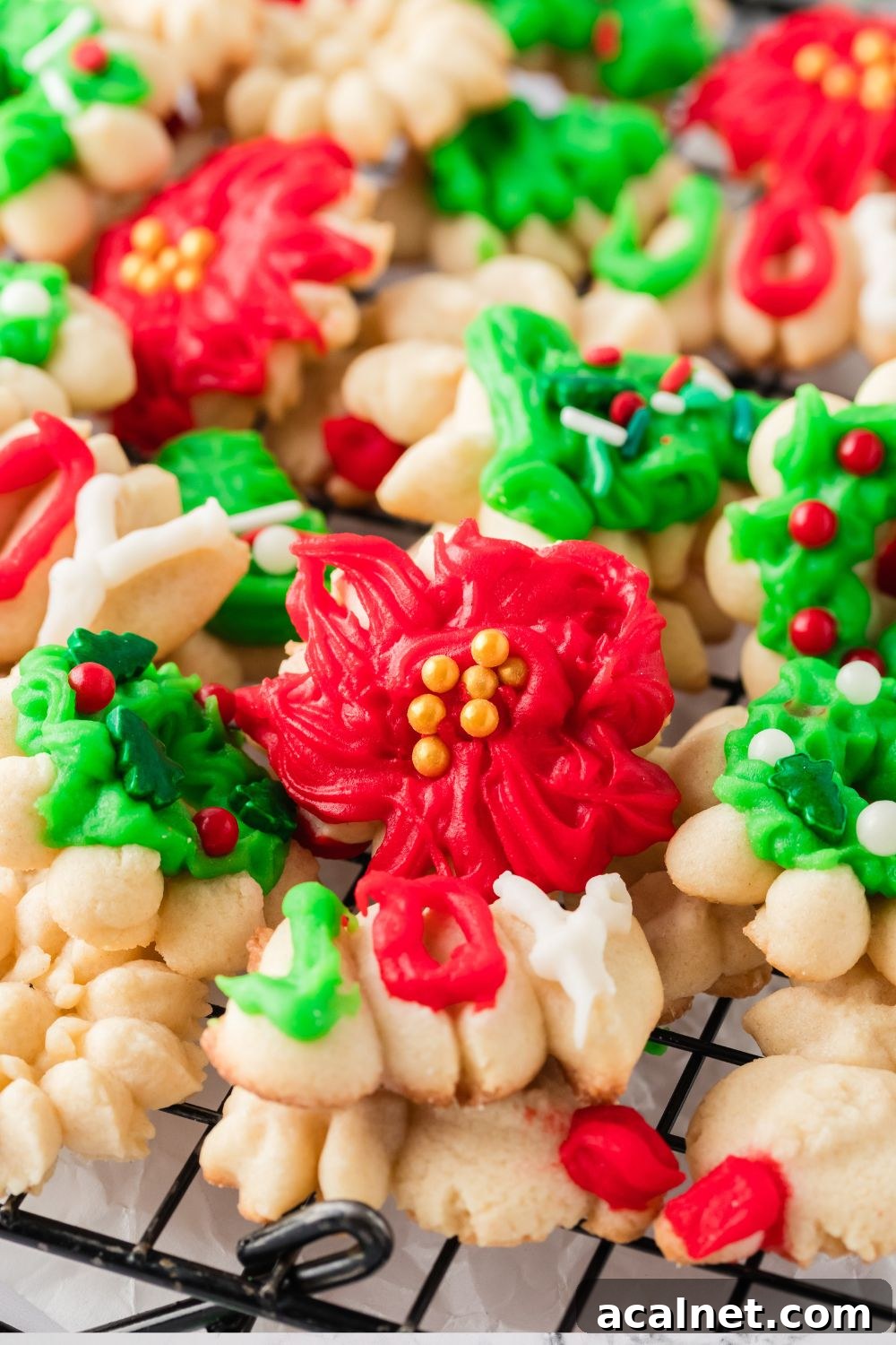Classic Christmas Spritz Cookie Recipe 5 Christmas Spritz Cookies stacked on a cooling rack