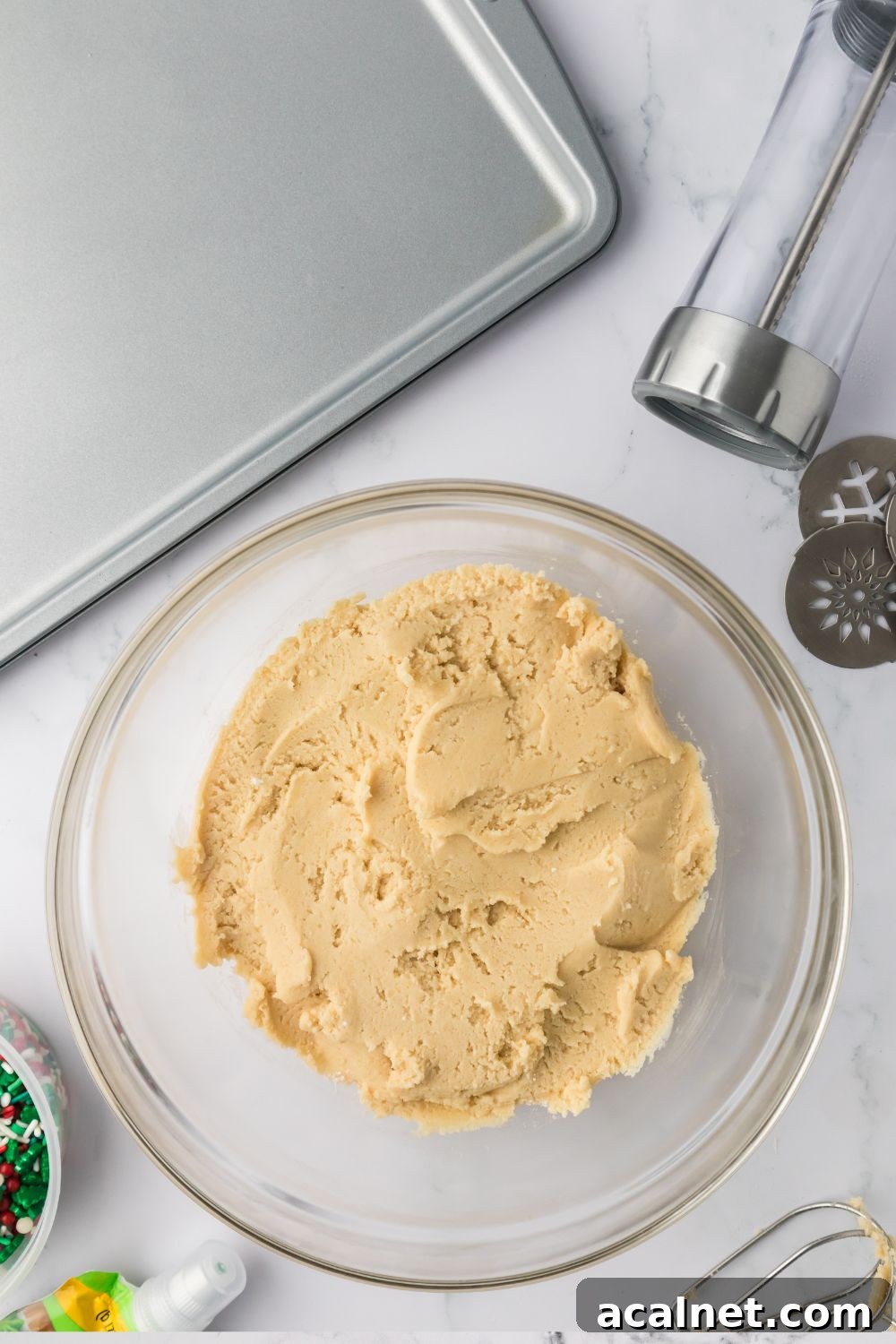 Classic Christmas Spritz Cookie Recipe 8 cookie dough in a glass bowl on table