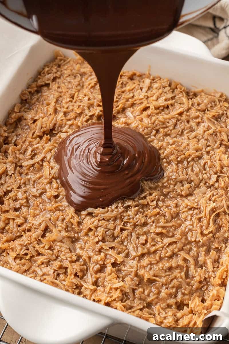 melted chocolate chips poured over samoa mixture
