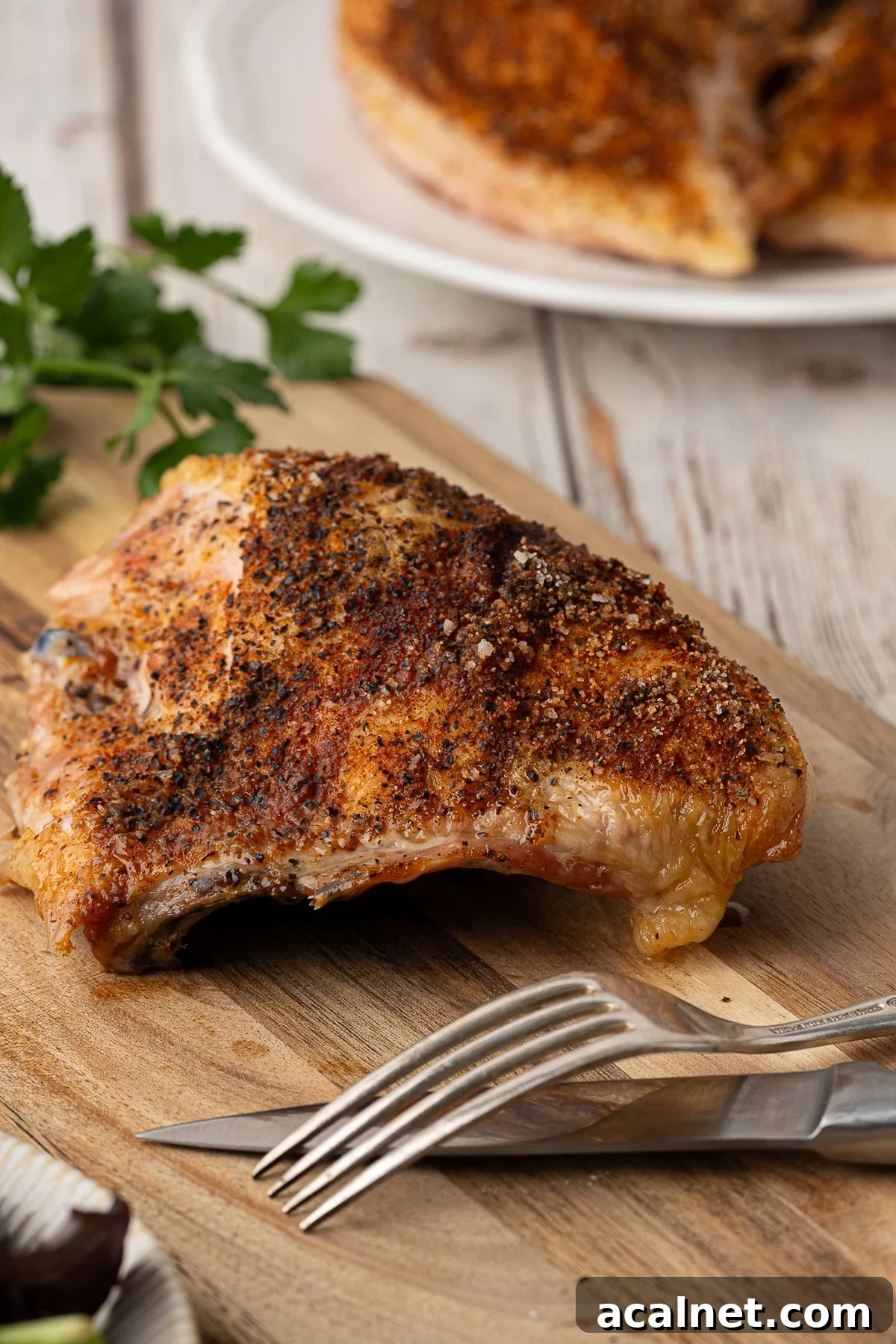 A sideview showing the crispy baked chicken skin.