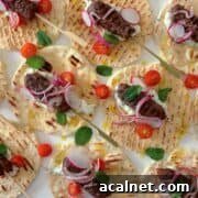Venison koftas with yoghurt dressing on flatbread.