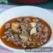 A white bowl filled with venison chili.