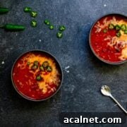 Two bowls filled with venison chili with beer.