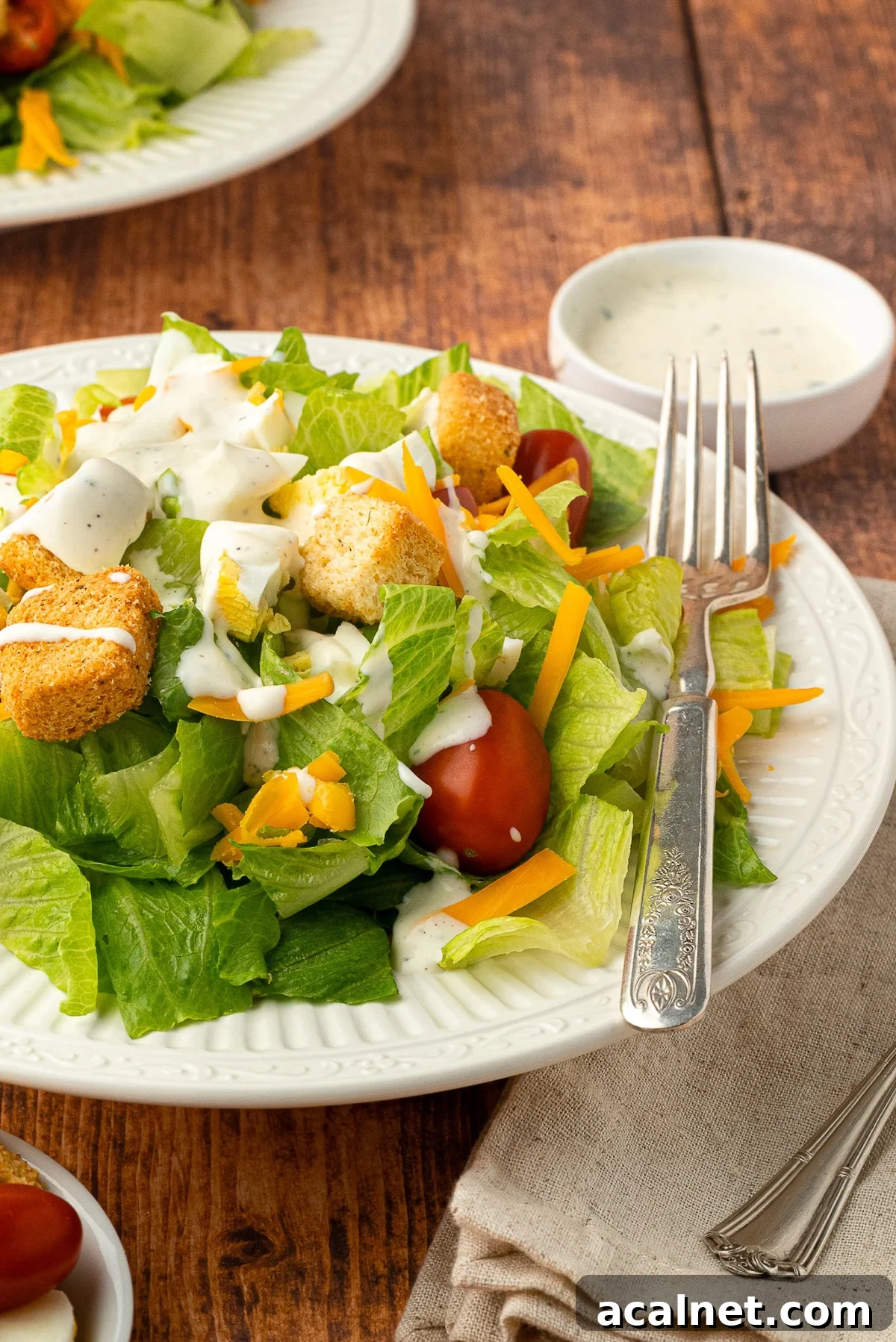 plated salad topped with ranch dressing