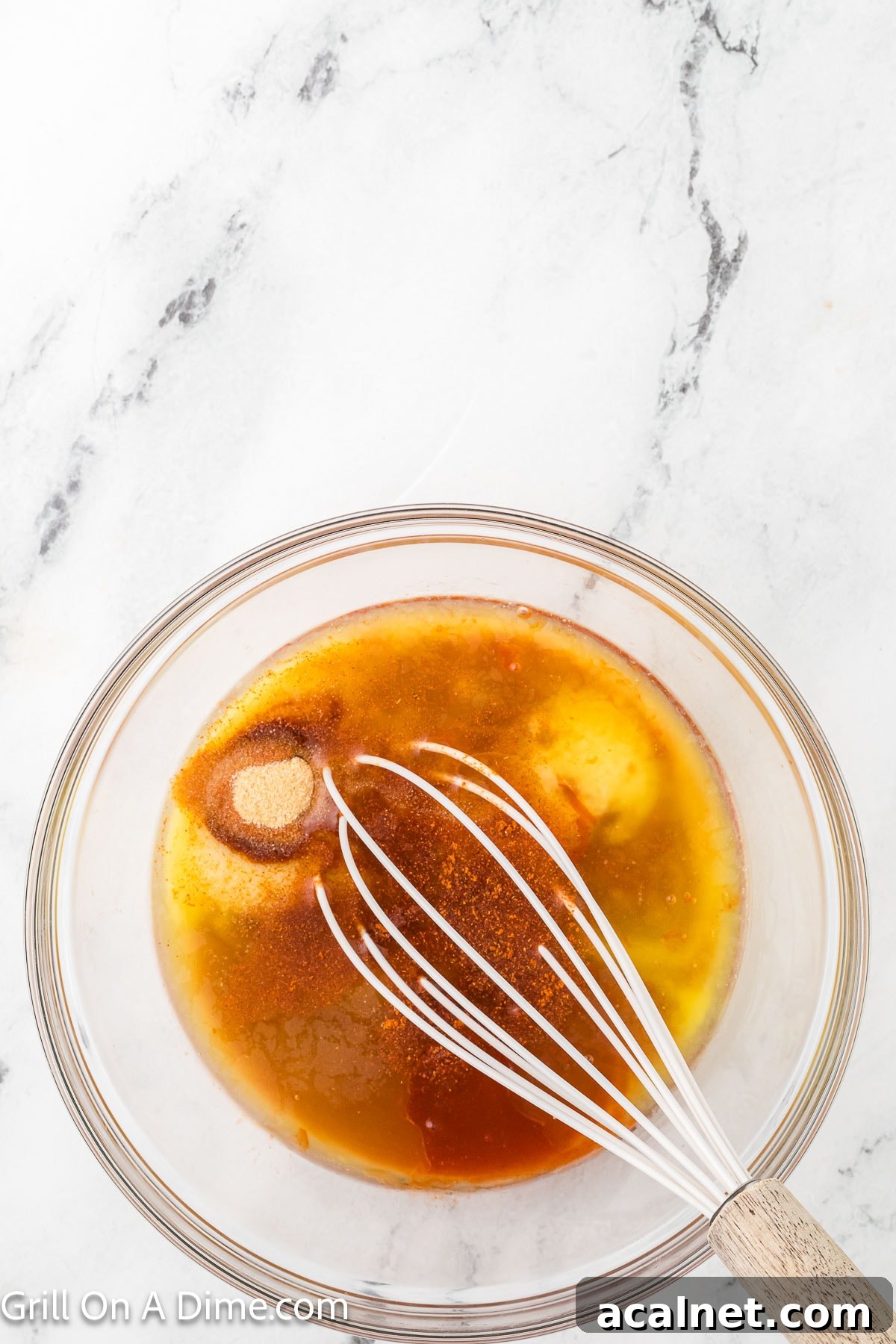 Whisking together the sauce ingredients in a bowl